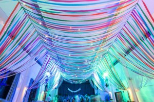colourful-ribbon-canopy-wedding-reception-town-village-hall-celebration-beautiful-oculux-lighting-evening